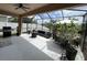 Spacious screened patio with outdoor furniture, perfect for entertaining and relaxation at 5229 Clover Mist Dr, Apollo Beach, FL 33572