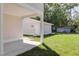 Backyard with well-maintained lawn features a detached garage and a house addition at 5337 6Th N Ave, St Petersburg, FL 33710