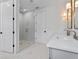 Bright bathroom featuring a glass shower and a double sink vanity with modern light fixtures at 5337 6Th N Ave, St Petersburg, FL 33710