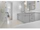 Stylish bathroom with dual sinks, framed mirrors, walk-in shower and soaking tub at 5337 6Th N Ave, St Petersburg, FL 33710