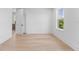 Bright bedroom with hardwood floors and one window allowing natural light with an open door and closet at 5337 6Th N Ave, St Petersburg, FL 33710