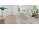 A bright bedroom with hardwood floors, neutral rug, and a well-lit interior from multiple windows at 5337 6Th N Ave, St Petersburg, FL 33710