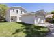 Exterior of a two-story house with a detached garage, showcasing its architecture and landscaping at 5337 6Th N Ave, St Petersburg, FL 33710