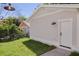 Detached garage with neutral siding and a brick paver walkway on a grassy lawn at 5337 6Th N Ave, St Petersburg, FL 33710