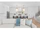 Modern kitchen featuring white cabinetry, a large island, and designer pendant lighting at 5337 6Th N Ave, St Petersburg, FL 33710