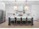 Bright kitchen features a large island with pendant lights, stainless steel appliances, and white subway tile backsplash at 5337 6Th N Ave, St Petersburg, FL 33710