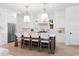 Well-appointed kitchen with white cabinetry, a center island, and modern pendant lights at 5337 6Th N Ave, St Petersburg, FL 33710
