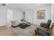 Bright sitting area with comfortable seating, a wooden coffee table, and modern artwork at 5337 6Th N Ave, St Petersburg, FL 33710