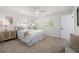 Serene bedroom featuring neutral tones, a comfortable bed, and ample natural light from the windows at 710 59Th Ave, St Pete Beach, FL 33706