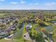 Stunning aerial view of a neighborhood with ponds and lush landscaping at 7440 Mint Julep Dr, Riverview, FL 33578