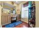 Bathroom with double sinks, vanity, ample counter space, and natural light from a window at 7440 Mint Julep Dr, Riverview, FL 33578