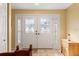 Welcoming entryway featuring decorative glass double doors and complementing side panel windows at 7440 Mint Julep Dr, Riverview, FL 33578