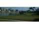 Waterfront property featuring a grassy lawn and private dock, ideal for boating and enjoying the waterfront lifestyle at 780 116Th Ave, Treasure Island, FL 33706