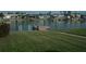 Serene waterfront property boasting lush green lawn and a private dock for seamless water access at 780 116Th Ave, Treasure Island, FL 33706