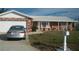 Charming single-story home with brick facade, white tile roof and manicured front yard at 780 116Th Ave, Treasure Island, FL 33706