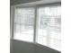 Bright natural light shines through the white blinds of the new windows at 780 116Th Ave, Treasure Island, FL 33706