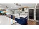 Modern kitchen featuring a large island with a farmhouse sink, white subway tile backsplash, and an open concept design at 1013 Newberger Rd, Lutz, FL 33549