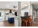 Bright and spacious kitchen featuring an island with blue cabinets and seating at a peninsula with wood accents at 1013 Newberger Rd, Lutz, FL 33549