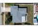 An aerial view showing the roof and backyard of this charming single-Gathering home at 10915 Hammock Dr, Largo, FL 33774