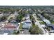 Drone shot highlighting homes and pools, nestled among the greenery of the neighborhood at 10915 Hammock Dr, Largo, FL 33774