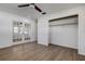 Bedroom showcasing closet and french doors at 10915 Hammock Dr, Largo, FL 33774