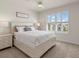Comfortable bedroom featuring a bed with a stylish bedhead and ample natural light from the window at 11617 Miracle Mile Dr, Riverview, FL 33578