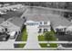 Beautiful two-story home featuring blue shutters, landscaped yard, and inviting covered front porch at 11617 Miracle Mile Dr, Riverview, FL 33578