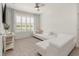 Inviting living room showcasing a comfortable white couch and view of the golf course at 11617 Miracle Mile Dr, Riverview, FL 33578