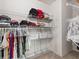 Organized walk-in closet with ample shelving and hanging space for clothing and accessories at 11617 Miracle Mile Dr, Riverview, FL 33578
