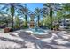A stunning tiered fountain in a community park with benches and lush greenery at 12406 Bristol Commons Cir, Tampa, FL 33626