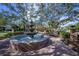 Beautiful community fountain surrounded by benches and trees, creating a relaxing gathering spot at 12406 Bristol Commons Cir, Tampa, FL 33626