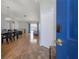 Entryway view of an open-concept living and dining area with hardwood floors at 12406 Bristol Commons Cir, Tampa, FL 33626