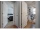 Hallway view showing access to a bedroom and a bathroom, providing easy access to each space at 12406 Bristol Commons Cir, Tampa, FL 33626