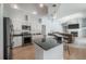Spacious kitchen with a breakfast bar, stainless steel appliances, and an open layout to the living area at 12406 Bristol Commons Cir, Tampa, FL 33626
