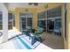 Relaxing lanai with comfortable seating, ideal for enjoying the outdoors in a cozy setting at 12406 Bristol Commons Cir, Tampa, FL 33626