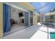 Bright sunroom with lanai access, showcasing a fireplace and comfortable seating area at 12406 Bristol Commons Cir, Tampa, FL 33626