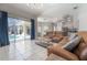 Open living area with sliding glass doors to a screened-in pool at 12406 Bristol Commons Cir, Tampa, FL 33626