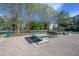 A community park with a ping pong table and seating areas for recreational activities at 12406 Bristol Commons Cir, Tampa, FL 33626