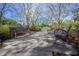 Serene park scene with benches along a shaded path, providing a tranquil outdoor experience at 12406 Bristol Commons Cir, Tampa, FL 33626