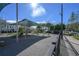 Community playground with modern equipment, shade structure, and safety surfacing for enjoyment at 12406 Bristol Commons Cir, Tampa, FL 33626