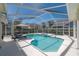 Enclosed pool area with screened lanai, providing a serene and private oasis for relaxation at 12406 Bristol Commons Cir, Tampa, FL 33626