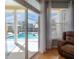 Inviting pool area visible from the living space with a covered lanai for outdoor lounging at 12406 Bristol Commons Cir, Tampa, FL 33626