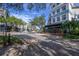 Charming street view with sidewalks, tree-lined streets, outdoor dining, and boutique shops at 12406 Bristol Commons Cir, Tampa, FL 33626
