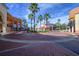 This lively town center is landscaped with palm trees and vibrant storefronts with outdoor seating at 12406 Bristol Commons Cir, Tampa, FL 33626