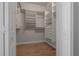 Spacious walk-in closet with ample shelving and storage, offering organized solutions at 12406 Bristol Commons Cir, Tampa, FL 33626
