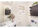 Well-lit bathroom with a modern sink, decorative shelves, and stylish décor at 12705 Longcrest Dr, Riverview, FL 33579