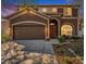 Charming two-story home with a well-manicured lawn, a two-car garage, and a welcoming red front door at 12705 Longcrest Dr, Riverview, FL 33579