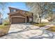 This shows the exterior of a lovely two-story home with a spacious driveway and well-kept landscaping at 12705 Longcrest Dr, Riverview, FL 33579