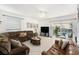 Spacious living room with tile floors and a large sliding glass door leading to the patio at 12705 Longcrest Dr, Riverview, FL 33579