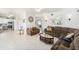 Spacious living room featuring tile floors, ceiling fans, and comfortable couches perfect for Gathering gatherings at 12705 Longcrest Dr, Riverview, FL 33579